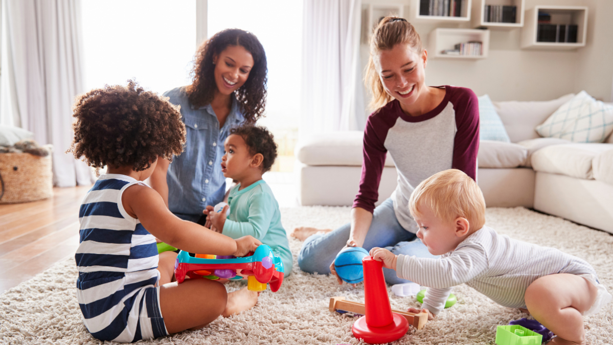 Two mums playing with their children