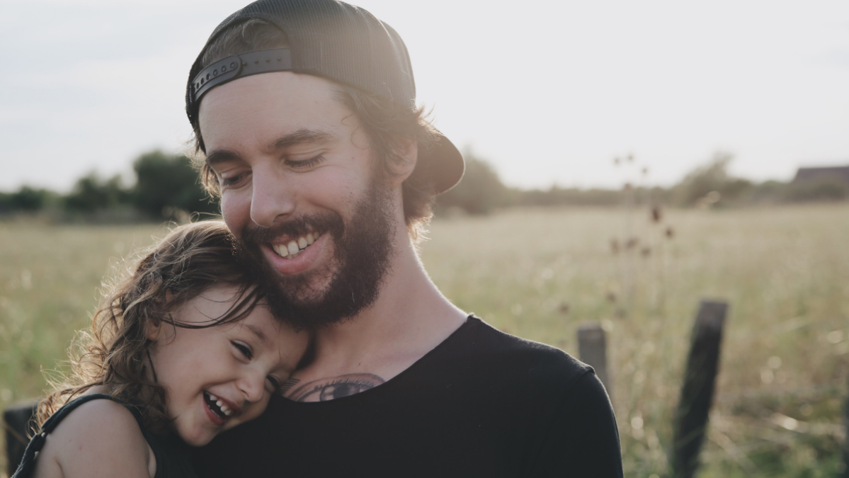 Dad with his daughter in a field