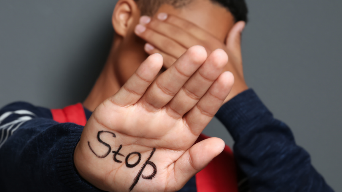 Teen boy with hand out